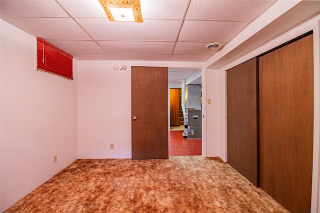3455 N Hillcrest Dr, Butte, MT 59701 - unfurnished bedroom featuring a paneled ceiling, carpet flooring, and a closet