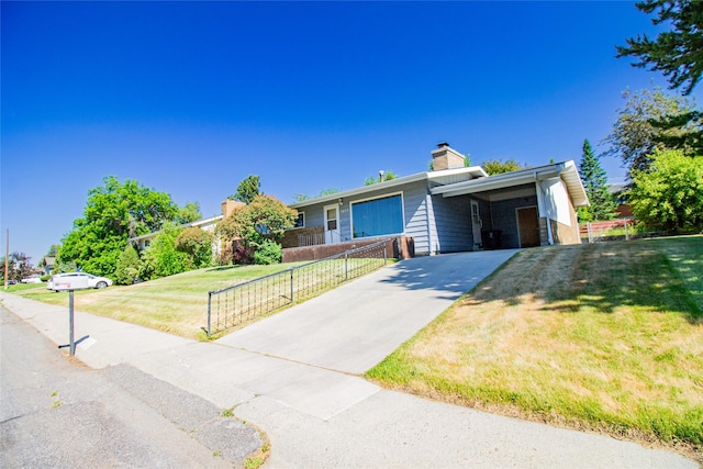 3455 N Hillcrest Dr, Butte, MT 59701 - view of front of property featuring driveway, an attached carport, and a chimney