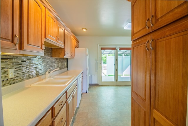 3455 N Hillcrest Dr, Butte, MT 59701 - kitchen featuring decorative backsplash, light countertops, light floors, brown cabinetry, and dishwasher