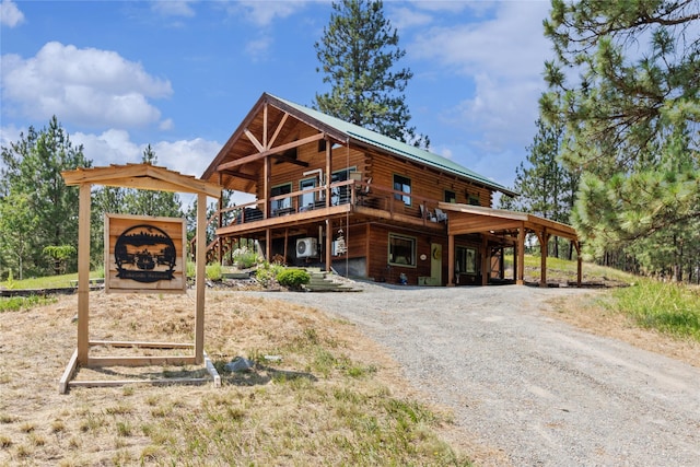 168 Carpenter Ln, Eureka, MT 59917 - view of front of home featuring dirt driveway and a deck