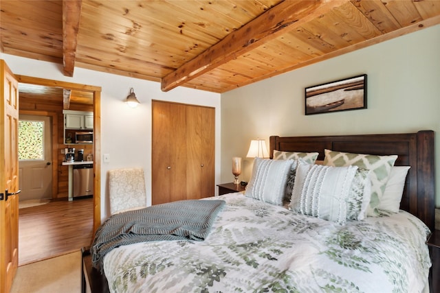168 Carpenter Ln, Eureka, MT 59917 - bedroom featuring a wooden ceiling with exposed beams, a closet, and wood finished floors