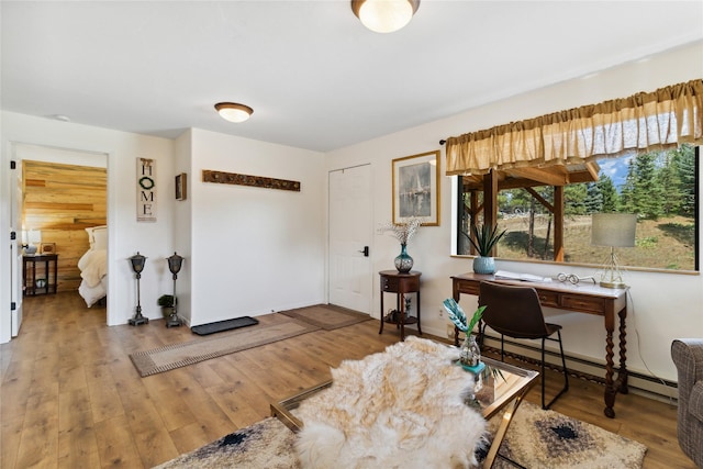 168 Carpenter Ln, Eureka, MT 59917 - office with a baseboard heating unit and wood finished floors