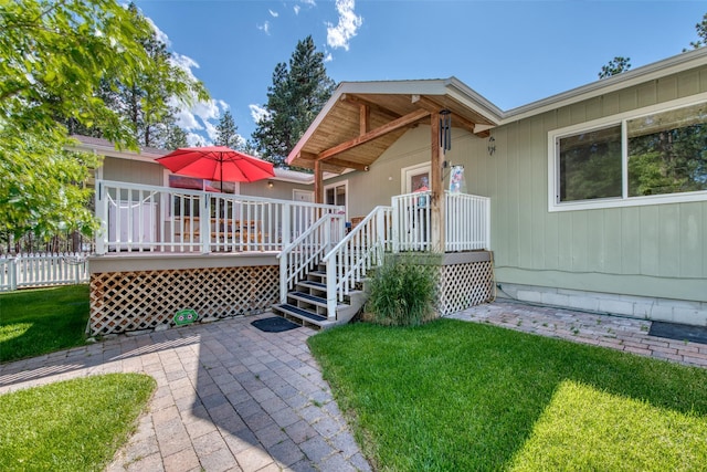 409 Mill Creek Rd, Hamilton, MT 59840 - view of front of property featuring a wooden deck and a patio