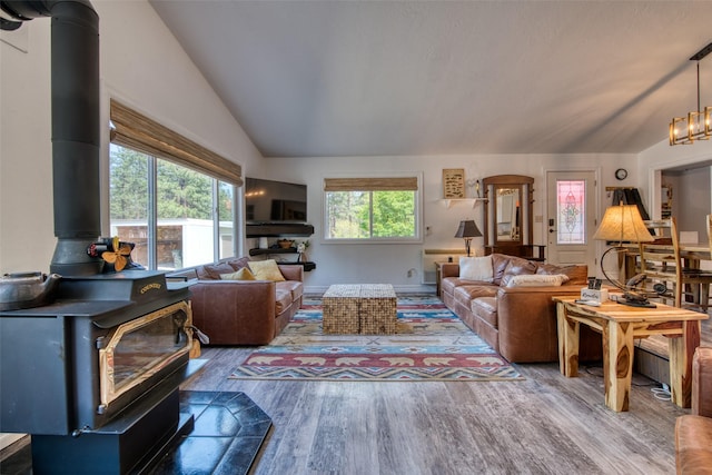 409 Mill Creek Rd, Hamilton, MT 59840 - living area with a wood stove, lofted ceiling, and wood finished floors