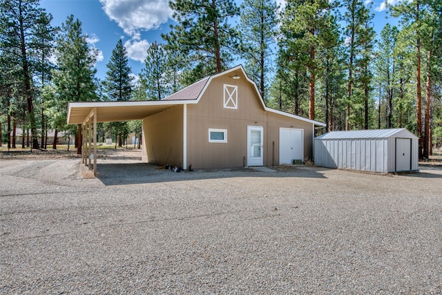 409 Mill Creek Rd, Hamilton, MT 59840 - view of front of property with an outbuilding, a barn, gravel driveway, and a carport