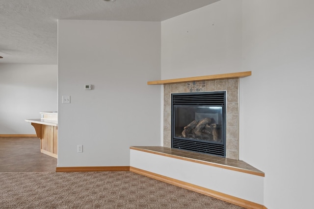 1228 Nordheim Ln, Corvallis, MT 59828 - detailed view of carpet floors, a tile fireplace, and a textured ceiling