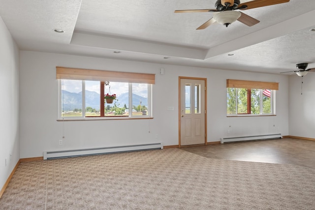 1228 Nordheim Ln, Corvallis, MT 59828 - carpeted empty room featuring a baseboard radiator, a baseboard heating unit, a ceiling fan, a textured ceiling, and recessed lighting