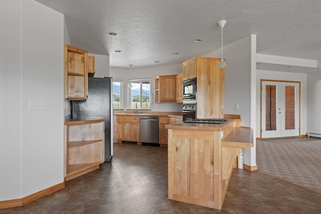 1228 Nordheim Ln, Corvallis, MT 59828 - kitchen featuring black appliances, a peninsula, light brown cabinetry, french doors, and a textured ceiling