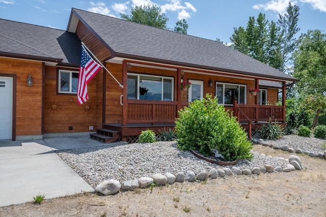 1228 Nordheim Ln, Corvallis, MT 59828 - chalet / cabin featuring covered porch and a shingled roof