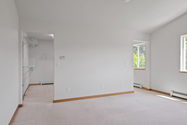 1228 Nordheim Ln, Corvallis, MT 59828 - unfurnished room featuring light carpet, a baseboard radiator, and a baseboard heating unit