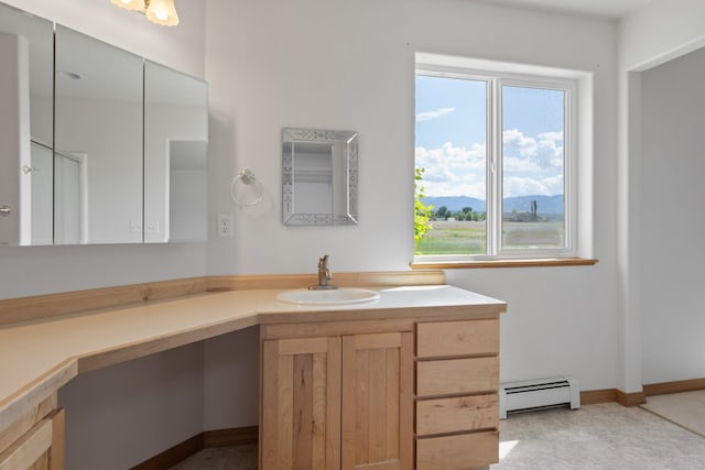 1228 Nordheim Ln, Corvallis, MT 59828 - bathroom with a baseboard radiator, vanity, healthy amount of natural light, and a mountain view