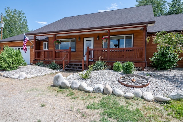 1228 Nordheim Ln, Corvallis, MT 59828 - chalet / cabin featuring a porch and a shingled roof