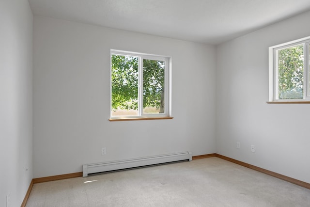 1228 Nordheim Ln, Corvallis, MT 59828 - spare room featuring baseboard heating and light carpet