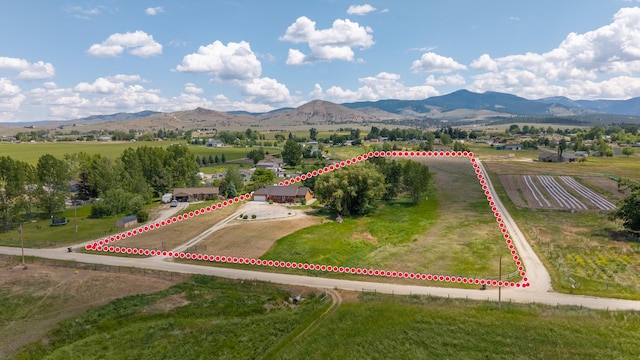 1228 Nordheim Ln, Corvallis, MT 59828 - overview of rural landscape featuring property parcel outlined and a mountain backdrop