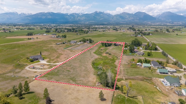 1228 Nordheim Ln, Corvallis, MT 59828 - aerial view of sparsely populated area featuring property boundaries highlighted and a mountainous background