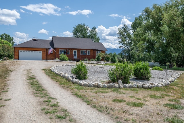 1228 Nordheim Ln, Corvallis, MT 59828 - view of front of property featuring driveway and a garage