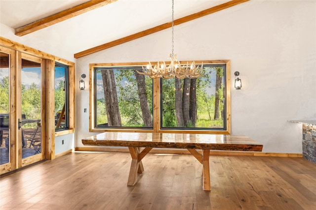 600 Ringneck Dr, Kalispell, MT 59901 - unfurnished dining area featuring a chandelier and hardwood / wood-style flooring