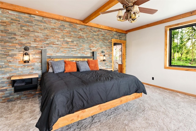 600 Ringneck Dr, Kalispell, MT 59901 - bedroom with carpet and beamed ceiling