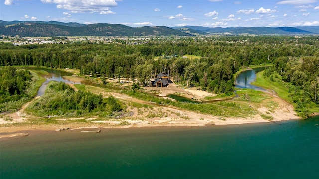 600 Ringneck Dr, Kalispell, MT 59901 - aerial overview of property's location with a heavily wooded area and a water and mountain view