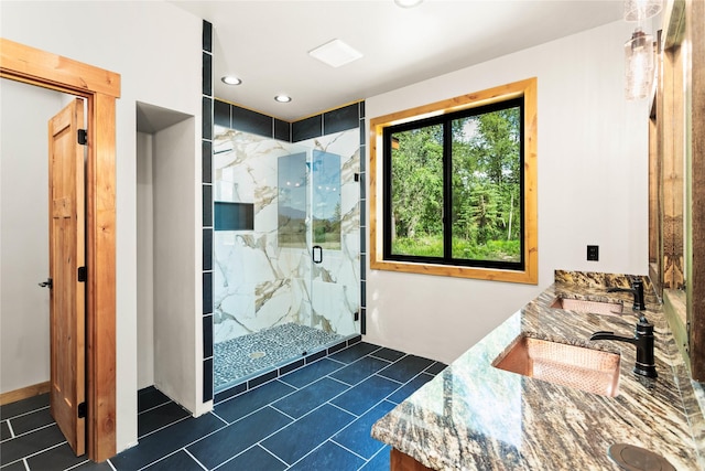 600 Ringneck Dr, Kalispell, MT 59901 - bathroom with a marble finish shower, tile patterned floors, double vanity, and recessed lighting
