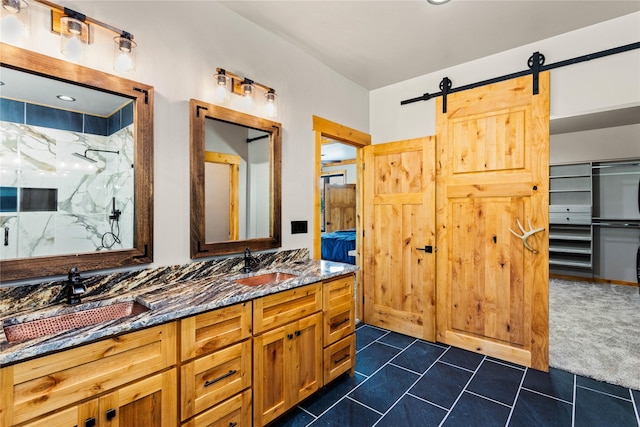 600 Ringneck Dr, Kalispell, MT 59901 - full bathroom featuring a marble finish shower and double vanity