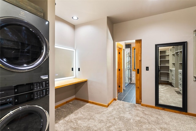 600 Ringneck Dr, Kalispell, MT 59901 - laundry area featuring stacked washer and clothes dryer, carpet flooring, and an office area