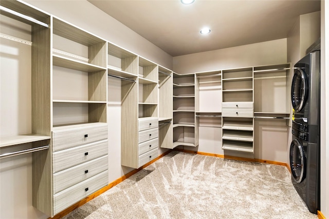 600 Ringneck Dr, Kalispell, MT 59901 - walk in closet featuring stacked washer / drying machine and carpet floors