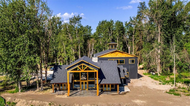 600 Ringneck Dr, Kalispell, MT 59901 - rear view of house with french doors and a shingled roof