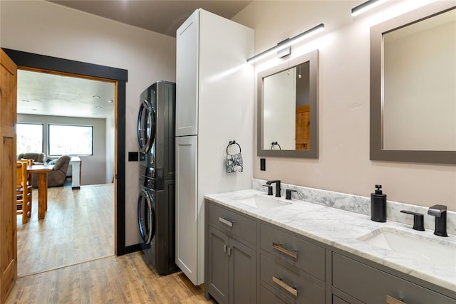 600 Ringneck Dr, Kalispell, MT 59901 - bathroom with estacked washer and dryer, wood finished floors, and double vanity