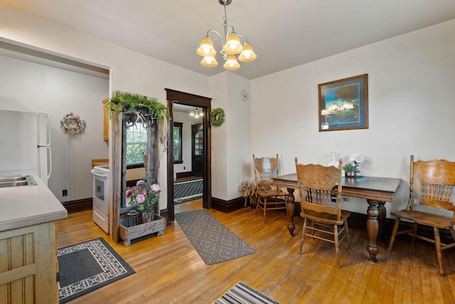 1380 Lower Valley Rd, Kalispell, MT 59901 - dining space with a chandelier and light wood finished floors