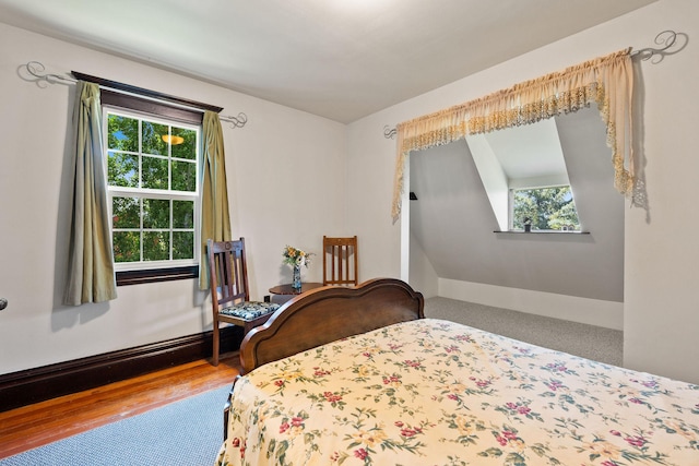 1380 Lower Valley Rd, Kalispell, MT 59901 - bedroom featuring multiple windows and wood finished floors