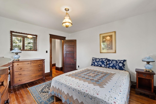 1380 Lower Valley Rd, Kalispell, MT 59901 - bedroom featuring dark wood-type flooring and baseboards