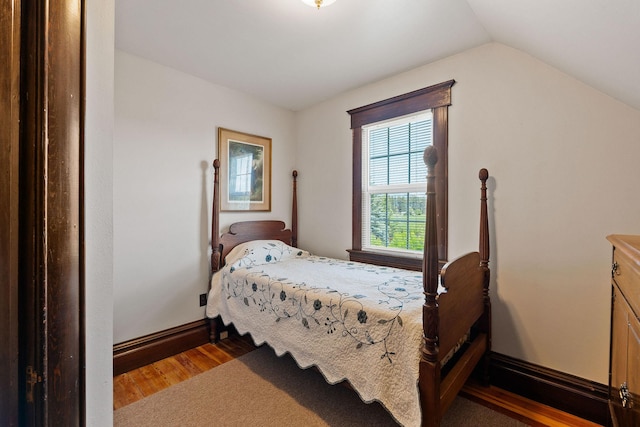 1380 Lower Valley Rd, Kalispell, MT 59901 - bedroom featuring wood finished floors and lofted ceiling