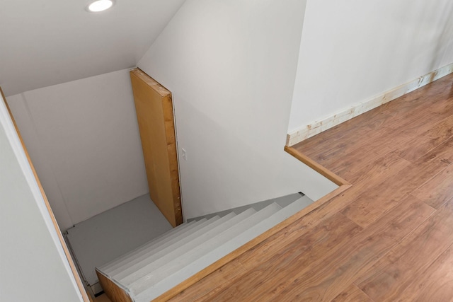 1380 Lower Valley Rd, Kalispell, MT 59901 - stairs featuring vaulted ceiling, wood finished floors, and recessed lighting