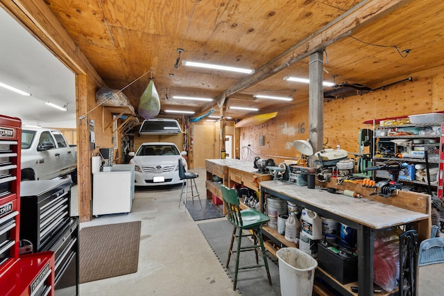 1380 Lower Valley Rd, Kalispell, MT 59901 - miscellaneous room featuring concrete floors, a workshop area, and wooden ceiling