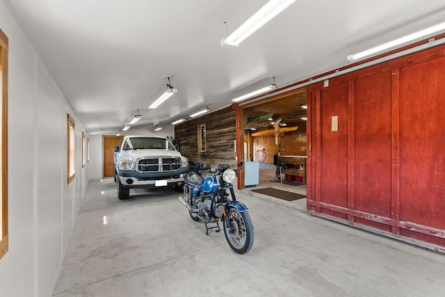 1380 Lower Valley Rd, Kalispell, MT 59901 - garage featuring wood walls