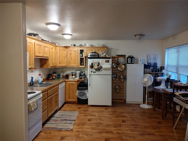2426 Ernest Ave, Missoula, MT 59801 - kitchen featuring white appliances, light wood-style flooring, and light brown cabinetry