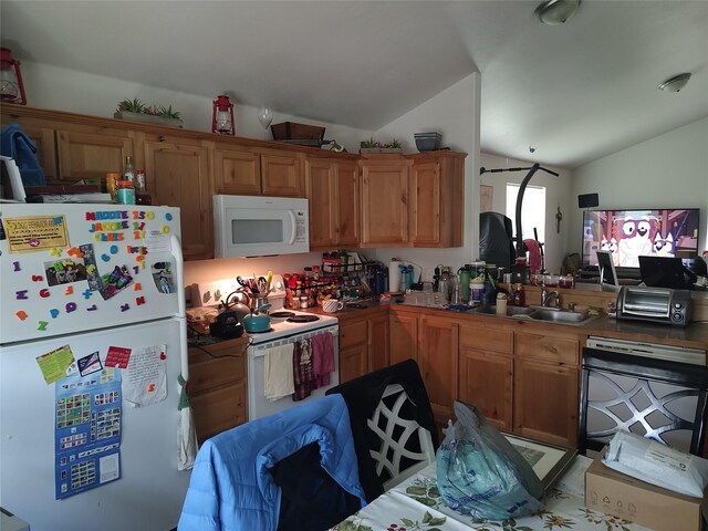 2426 Ernest Ave, Missoula, MT 59801 - kitchen with white appliances, vaulted ceiling, and brown cabinets