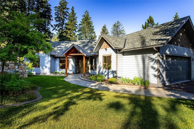 33731 Westview Dr, Bigfork, MT 59911 - view of front facade with a front yard, a garage, and a shingled roof