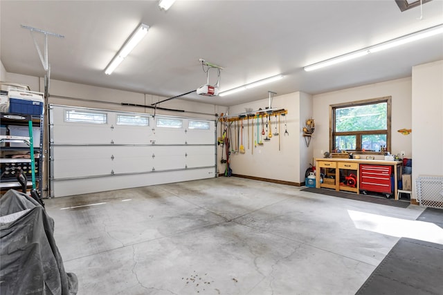 33731 Westview Dr, Bigfork, MT 59911 - garage with a garage door opener and a workshop area