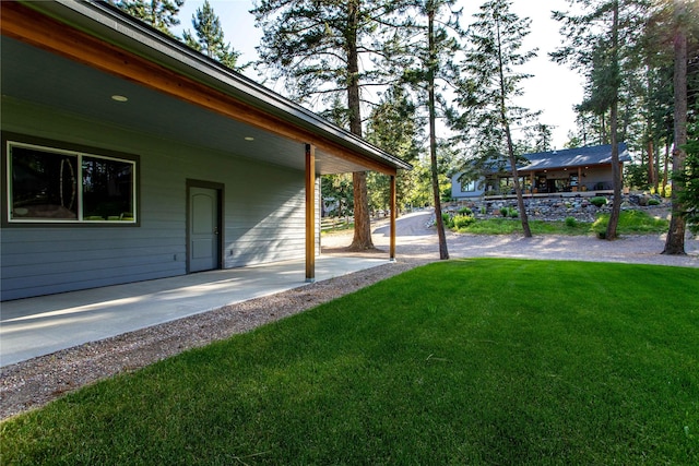 33731 Westview Dr, Bigfork, MT 59911 - view of green lawn with a patio