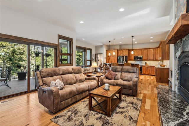 33731 Westview Dr, Bigfork, MT 59911 - living area with a fireplace, light wood finished floors, and recessed lighting