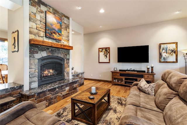 33731 Westview Dr, Bigfork, MT 59911 - living room with wood finished floors, a fireplace, and recessed lighting