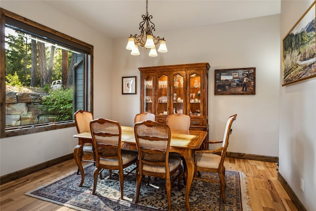 33731 Westview Dr, Bigfork, MT 59911 - dining space featuring a chandelier and light wood-type flooring