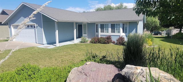22 B Ave, Polson, MT 59860 - ranch-style home featuring a garage, a front yard, driveway, and a porch