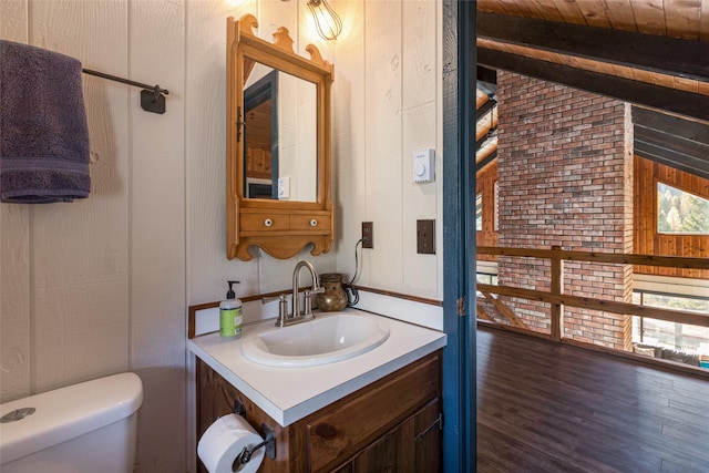 630 Tally Lake Rd, Whitefish, MT 59937 - bathroom featuring wood ceiling, vanity, wood finished floors, and wood walls