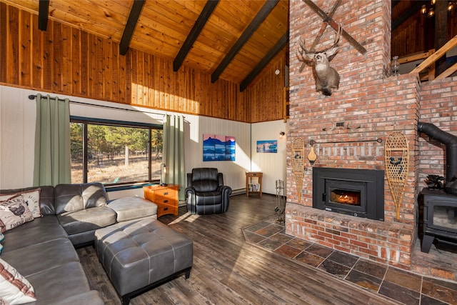 630 Tally Lake Rd, Whitefish, MT 59937 - living room with a wood stove, high vaulted ceiling, a wood ceiling with exposed beams, wooden walls, and wood finished floors