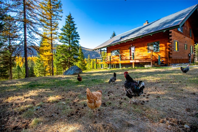 630 Tally Lake Rd, Whitefish, MT 59937 - view of yard with a deck with mountain view
