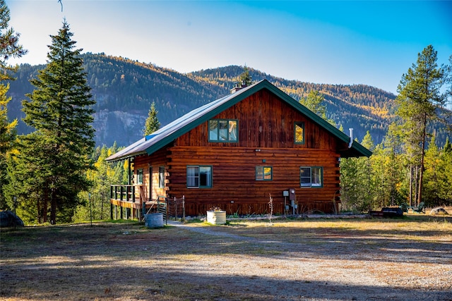 630 Tally Lake Rd, Whitefish, MT 59937 - view of side of home with a mountain view and log exterior
