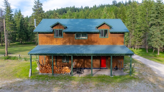 630 Tally Lake Rd, Whitefish, MT 59937 - view of front facade featuring a wooded view and a metal roof
